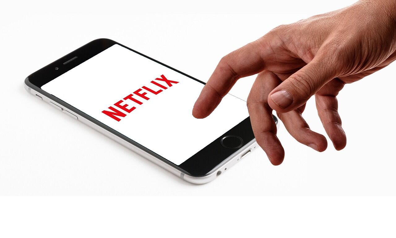 A person watching Netflix on a TV at home