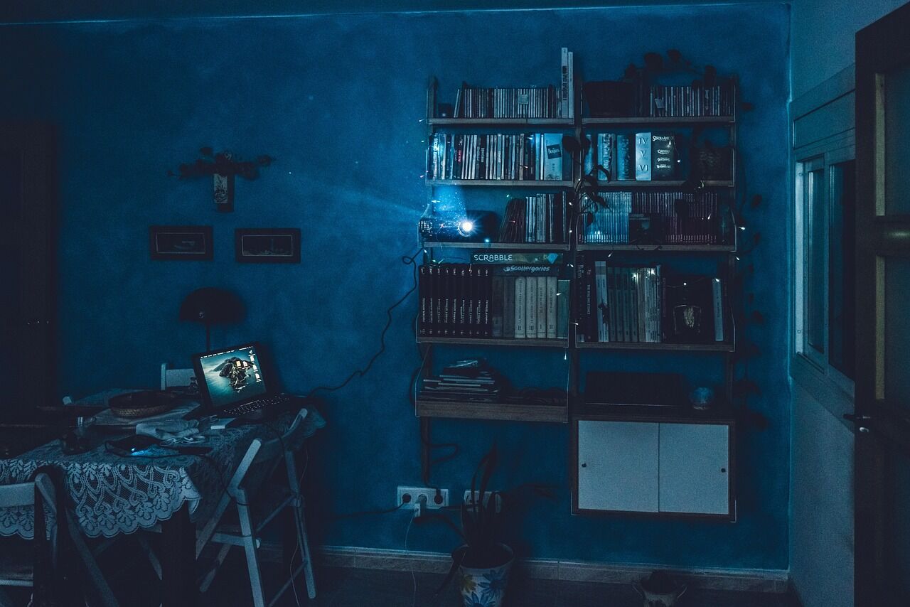 A home cinema projector displaying a movie